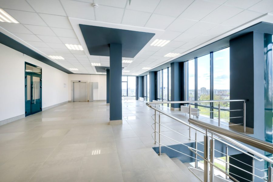Commercial painters coating an office interior after hours